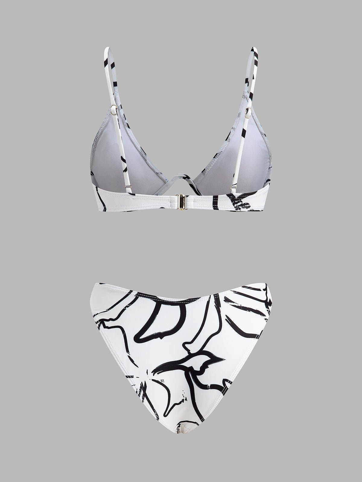 Şık Soyut Üçgen Bikini Takımı ile Trendy Plaj Görünümü - Phentora